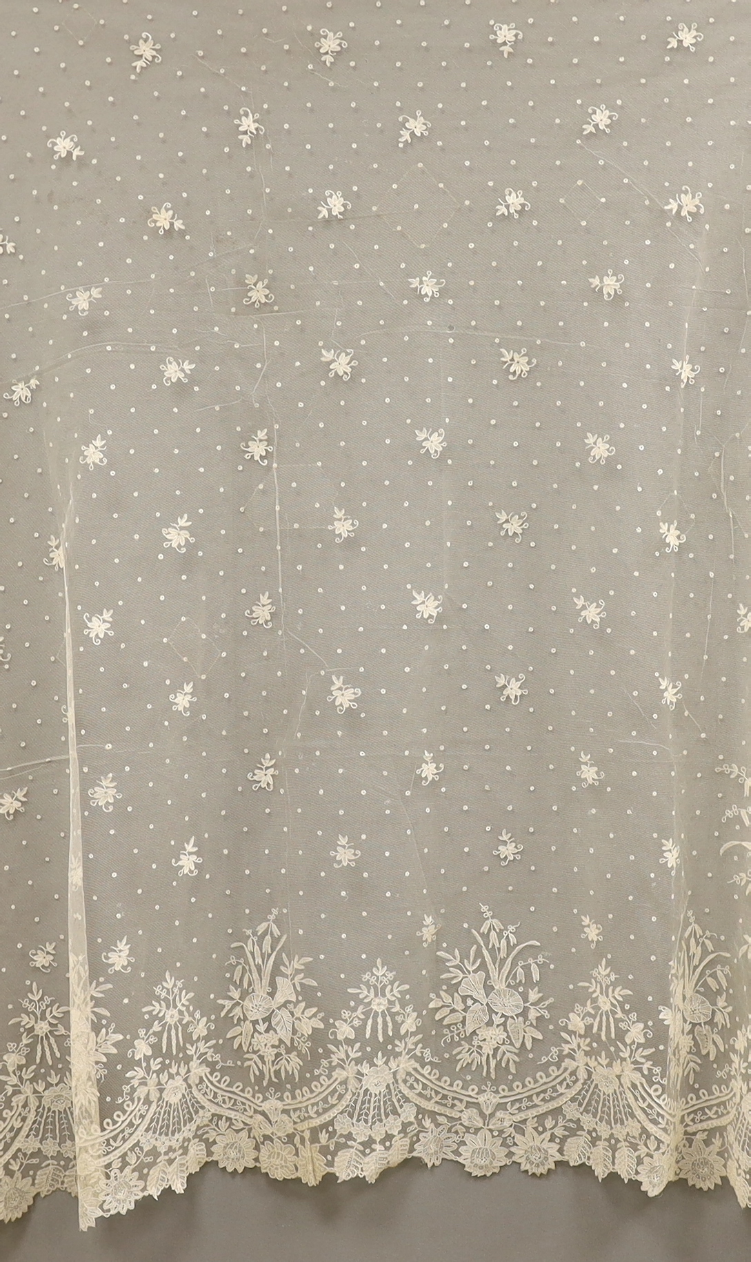 A 19th century Brussels bobbin lace wedding veil with point de gaze needle lace border and insertions, 196cm x 192cm